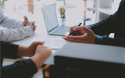 advisor and clients at desk